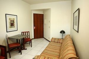 Uma área de estar em Cheverny Apart Hotel