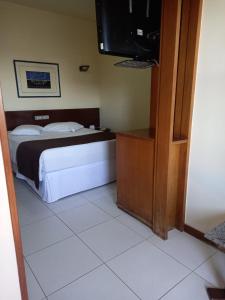 Cama ou camas em um quarto em Cheverny Apart Hotel