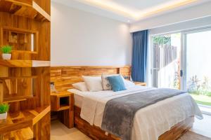 a bedroom with a bed and a large window at Hermosa Waves D1 in Jacó +38 photos