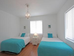 Postel nebo postele na pokoji v ubytování Bikini Lodge