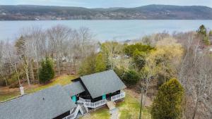 an overhead view of a house with a view of the water at Tucked Away Walk to Beach Pet Friendly Relax in Rothesay