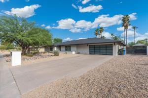 a house with a driveway in front of it at 6 Bed Luxury Heated Pool in Phoenix