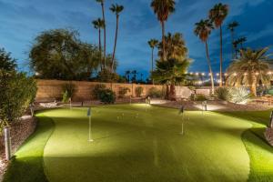 a golf course at night with palm trees at 6 Bed Luxury Heated Pool in Phoenix