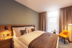 Ένα ή περισσότερα κρεβάτια σε δωμάτιο στο Holiday Inn - the niu, Loom Manchester North by IHG