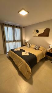 a bedroom with a large bed with towels on it at Guesthouse Park in Córdoba +47 photos