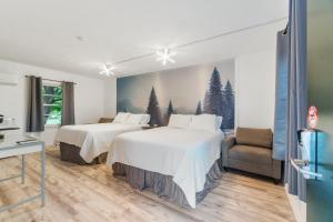Ένα ή περισσότερα κρεβάτια σε δωμάτιο στο Motel Somerset