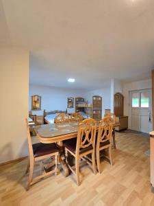 a dining room with a table and chairs at STD "Vila Bor" in Crni Vrh