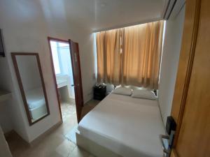 Postel nebo postele na pokoji v ubytování Hotel Cartagena Premium
