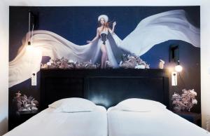 Postel nebo postele na pokoji v ubytování Hôtel Graffalgar