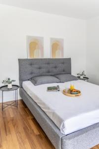 a bedroom with a bed with a tray of food on it at Private pool Villa in Athens +50 photos