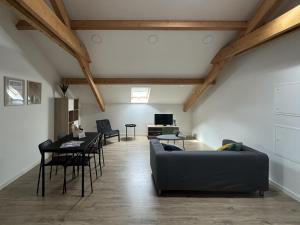 a living room with a couch and a table at S'apartments in Leiria
