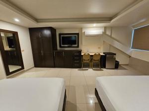 TV a/nebo společenská místnost v ubytování Hotel Maria Elena