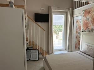 Postel nebo postele na pokoji v ubytování Residence PEGA B&B