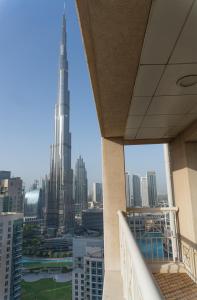 a view of the burj khalifa from a balcony of a building at Downtown Oasis, Burj Khalifa Views, Luxury Amenities in Dubai