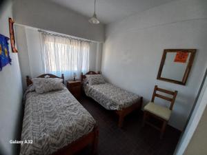 Postel nebo postele na pokoji v ubytování Arrayanes Apart