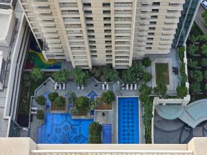 an overhead view of a building with a pool at Downtown Oasis, Burj Khalifa Views, Luxury Amenities in Dubai