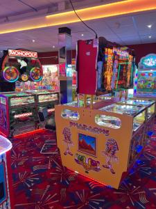 a pinocchio arcade with a sign in the middle at Lyons Robin Hood Caravan in Rhyl-5 min walk to Beach ,FREE Wi-Fi and FREE parking for 4 cars, sleeps up to 8 people-3 bedrooms in Rhyl