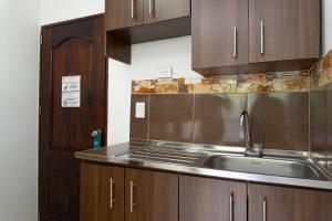 Kuchyň nebo kuchyňský kout v ubytování Hotel Palo Alto Laureles