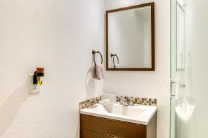 a bathroom with a sink and a mirror at Scenic Aurora Studio on 3 Acres Easy 1-70 Access in Aurora +16 photos