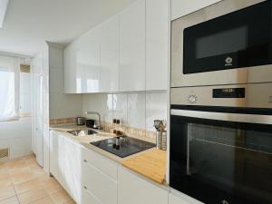 Kuchyň nebo kuchyňský kout v ubytování Piso Millenium