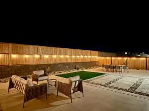 a patio with a table and chairs and lights at Spacious new house in Folsom Ranch 4BD and 3BA with backyard and BBQ grill in Folsom