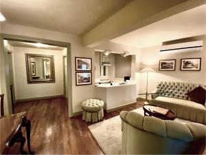 a living room with a couch and a sink at Casa Corp Boutique Suites in Condesa in Mexico City