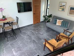 Televisyen dan/atau pusat hiburan di Casa Carolina Loft Romace