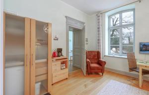 a room with a desk and a chair and a cabinet at Gorgeous Apartment In Krakow Am See in Krakow am See