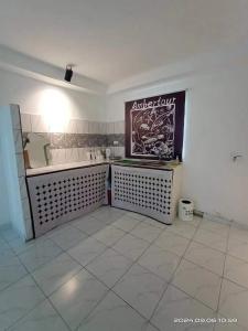 a white room with a sign on the wall at Amberhouse 1 in Semporna