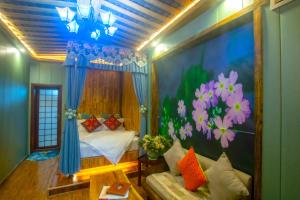 Postel nebo postele na pokoji v ubytování Floral Hotel · Baihui Living Zhangjiajie