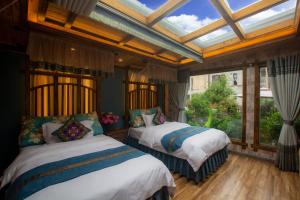 Rúm í herbergi á Floral Hotel · Baihui Living Zhangjiajie