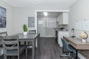 a kitchen and dining room with a table and chairs at Buckhead 2br Free Parking & Wi-fi in Atlanta +29 photos