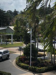 a car parked in a parking lot with a street light at Superior Studio 20 Endeavour Inn in Emu Park