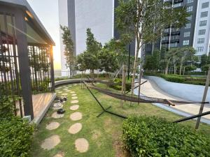 an empty playground with a slide in a city at Adamanly Homestay at Gamuda Cove, Splashmania in Pulau Kempas
