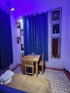 Postel nebo postele na pokoji v ubytování Chuchumbé Hotel & Hostal