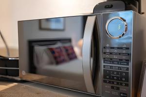 a microwave oven with a couch inside of it at 12 de Octubre in Cabo San Lucas