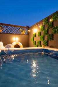 a swimming pool at a hotel with lights on it at The Urban Sanctuary Paju in Paju
