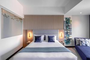Letto o letti in una camera di Oakwood Merdeka Bandung