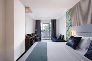 Letto o letti in una camera di Oakwood Merdeka Bandung