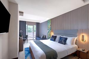 Letto o letti in una camera di Oakwood Merdeka Bandung