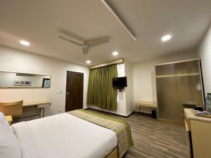 TV a/nebo společenská místnost v ubytování Heritage Residency By Lemongrove Hospitality