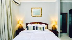 Ένα ή περισσότερα κρεβάτια σε δωμάτιο στο Puri Puspa Jimbaran +9 φωτογραφίες