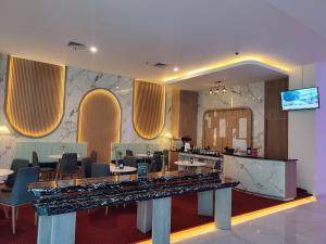 TV a/nebo společenská místnost v ubytování UNHAS HOTEL & CONVENTION