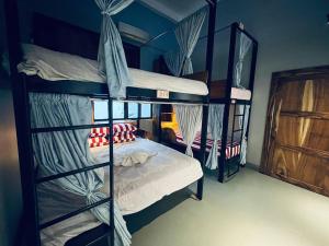Postel nebo postele na pokoji v ubytování Por Chey Guesthouse