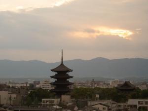 a view of a city with mountains in the background at Loisir Hotel Kyoto Toji in Kyoto