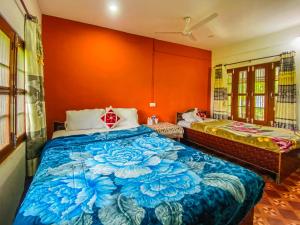 Katil atau katil-katil dalam bilik di Hotel Tiger's Den - Peace Home Cozy Garden