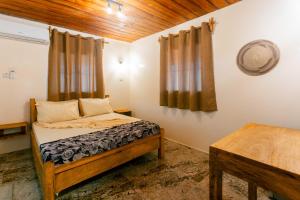 Postel nebo postele na pokoji v ubytování Roots inn