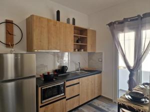 Η κουζίνα ή μικρή κουζίνα στο Fira gem luxury apartment