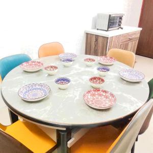 a table with many bowls on top of it at Happy Gather Homestay 欢聚阁 in Ipoh