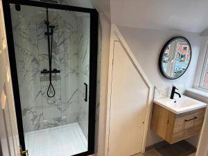 a bathroom with a shower and a sink at 12 Clos Yr Wylan in Barry +31 photos